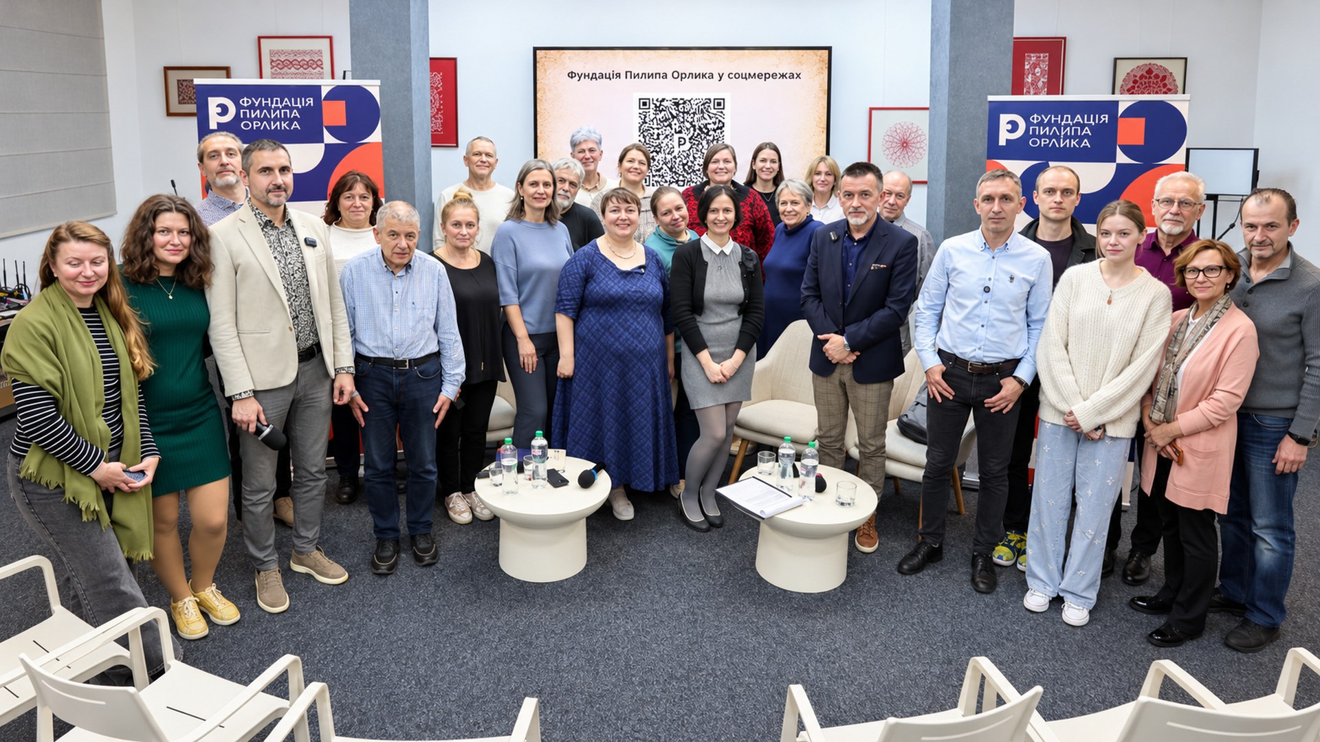 Group photo of guests and participants of the panel discussion in a hall with Pylyp Orlyk Foundation banners