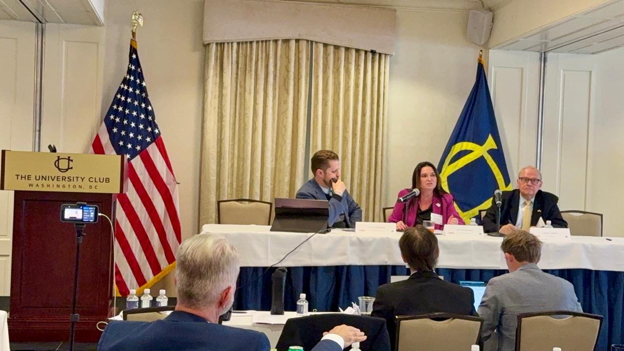 Lesia Yastrubetska speaking at the presidium table of the CUSUR roundtable at The University Club of Washington, D.C.