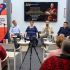Учасники панельної дискусії «Ефект метелика Орликової конституції» сидять у кріслах перед глядачами, на екрані — портрет гетьмана