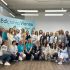 Учасники освітнього заходу EdCamp Vienna, українські педагоги та експерти на фоні банера EdcampVienna